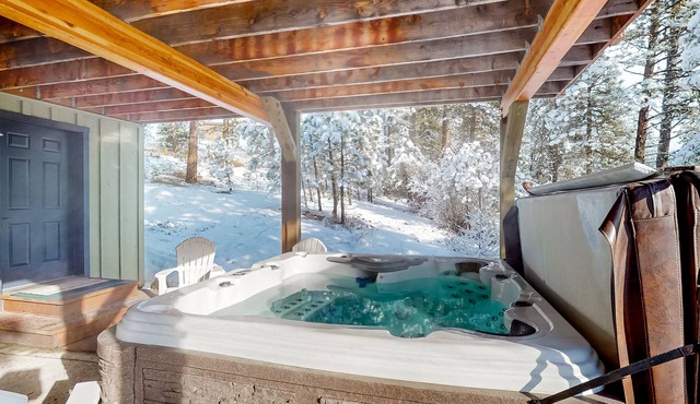 Mountain-view cabin with private hot tub, furnished deck, 2 kitchens, & 2 W/Ds