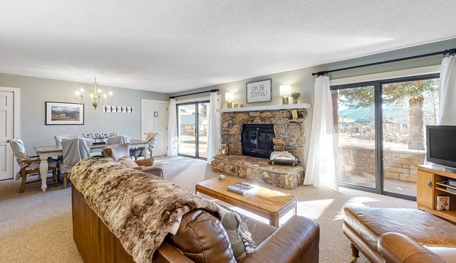 Mountain-view condo with private deck, fireplace & hot tub
