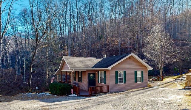 Mountain view home with a fireplace with beautiful view of the creek