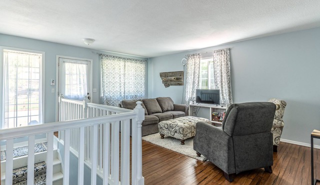 Mountain-view home with large deck, gas grill, firepit, lawn, and central AC