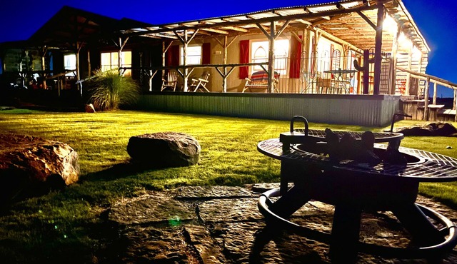 Mountain views, wrap around porch, incredible lawn with fire pit!