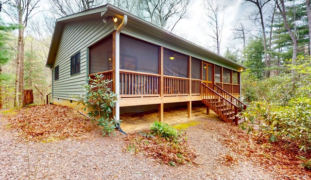 Mountainside abode with a wood stove, firepit, grill, sunroom, AC, and W/D