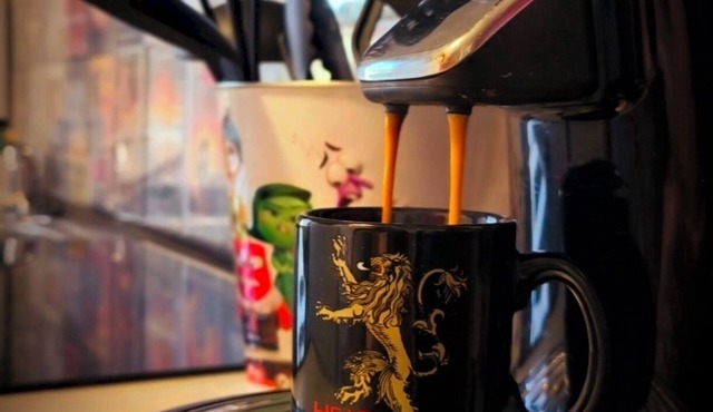 Movie-themed apartment with large screen