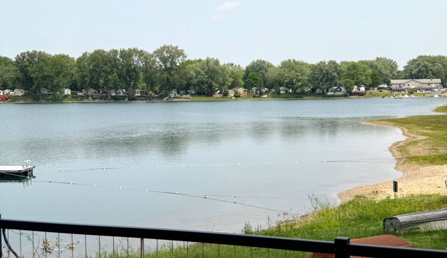 MTM Premier - The Funky Duo combines Funky Island and Funky Jungle—two side-by-side lakefront properties sleeping 12 total. A bright park model and cozy log cabin with shared campground amenities, perfect for larger groups.