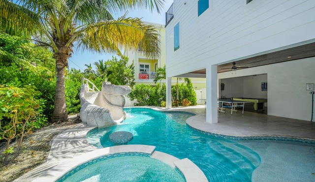 Multi family beach house! 9 bedrooms, pool with waterslide + rooftop deck