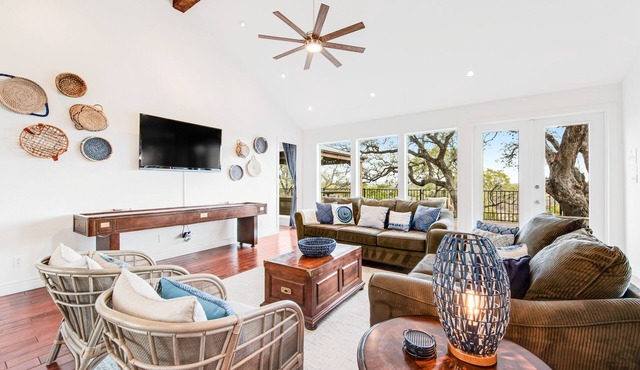 Natural cliffside oasis with impressive views, gas fireplace and dock
