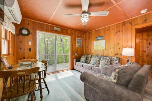 Near Snowmobiling! Carp Lake Cottage with Fire Pit