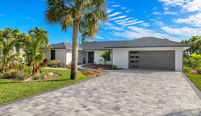 Nestled along a pristine canal with long range views, this meticulously crafted residence defines coastal luxury at its finest.NEW!