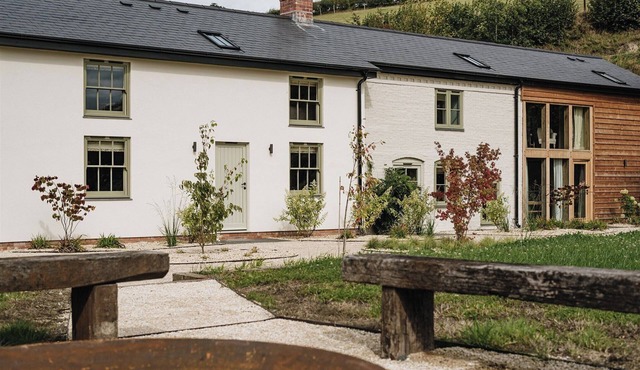 Nestled in a serene Welsh valley, this unique mill conversion blends historic charm with modern comfort offering inviting spaces for memorable family gatherings or inspiring corporate away days.
