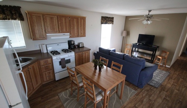 Nestled in nature, the cabin resides near a tranquil pond, perfect for fishing