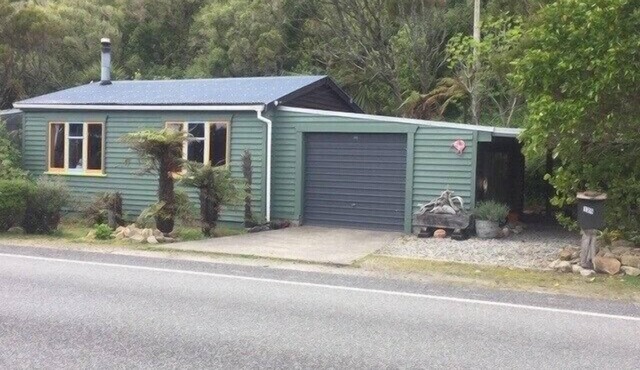 Nestled in the beautiful New Zealand bush a classic Kiwi bach.