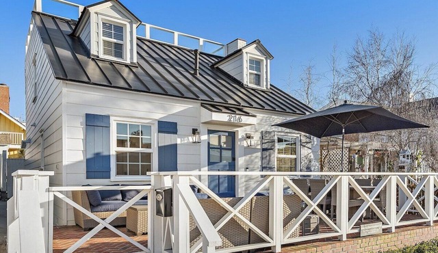 Nestled in the heart of Corona del Mar's coveted "Flower Streets," 216 Fernleaf Ave is the quintessential coastal cottage that captures the effortless charm and laid-back luxury of classic SoCal beach living.