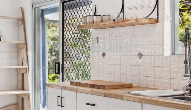 Nestled in the heart of the serene seaside village of Red Rock.