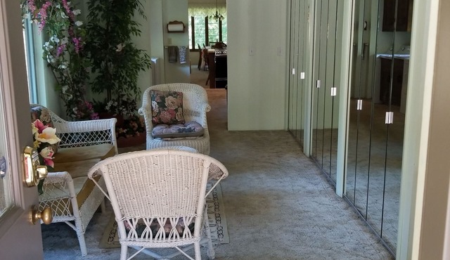 Nestled near woods and creek, this large home is near state parks and colleges.