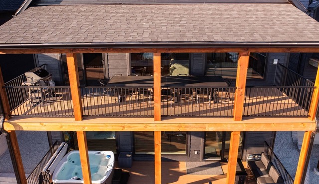 New 7 bdrm home (sleeps 28) w/lake views, hot tub, & outdoor dining!