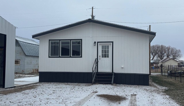 New and comfortable home with open floor plan and electric fireplace.