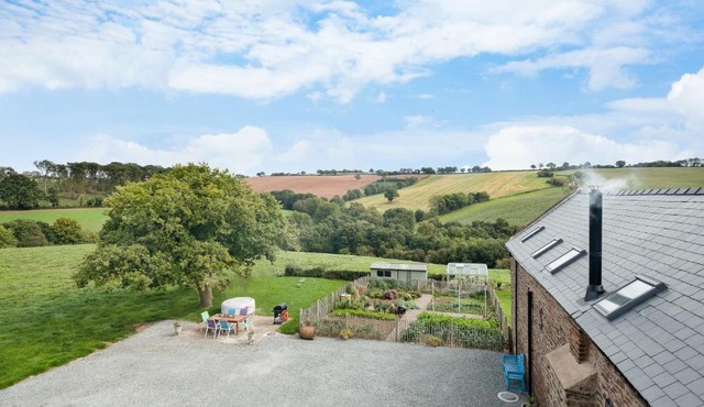 NEW Barn Conversion. Idyllic and unspoiled views complete with Hot Tub and Fire