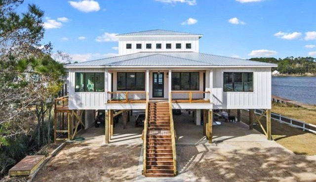 New, bayfront custom home with pier for your boat plus outside deck