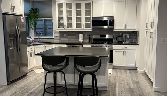 New centrally located townhouse with rooftop deck. Walk to restaurants and shops