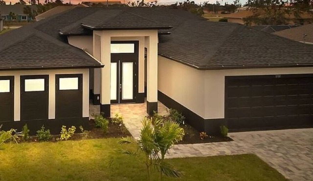 New Construction - Elegant Fresh Water Canal Home w/Heated Pool