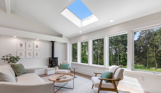 New construction - upper-level home with expansive deck & orchard views