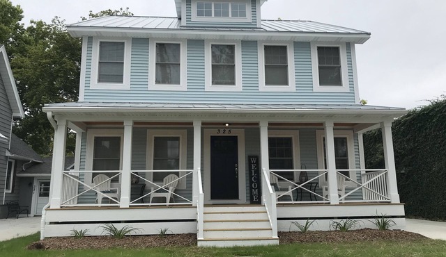 New Home with swim spa, theatre & game room. 1 block to town & close to beach.