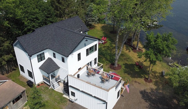 New house, sleeps 15, 5 car parking. Separate building with bar. Pets welcome!