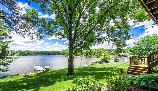 New- listing! 6 BR wooded lakefront home.