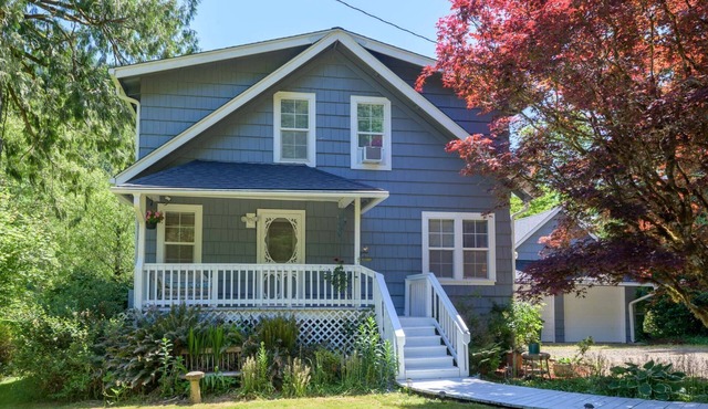 New Listing! Beautiful riverfront farm style home with amazing views and hot tub