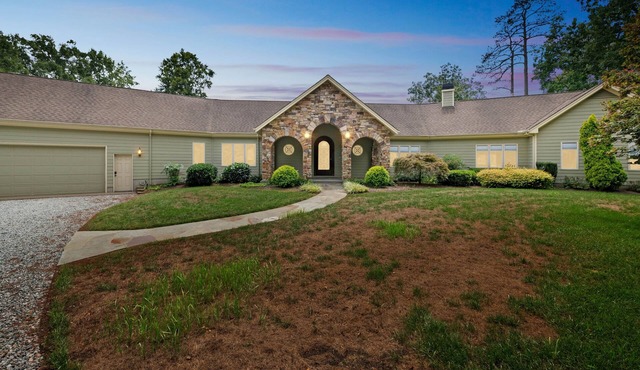 NEW LISTING! Hidden Waterfront Luxury Oasis with 9-Acre Pond by RedAwning