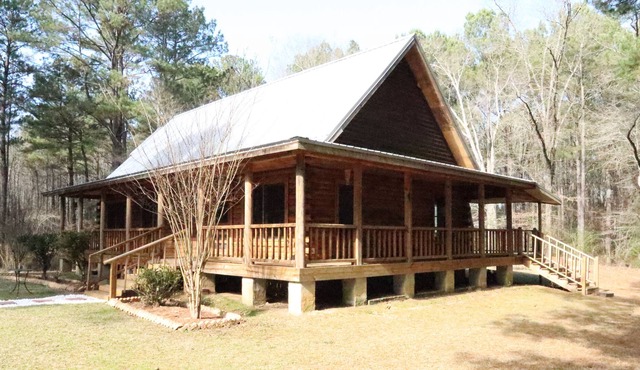 *New Listing Limited Time Price Special* Log Cabin retreat on 40 acres of pine forest