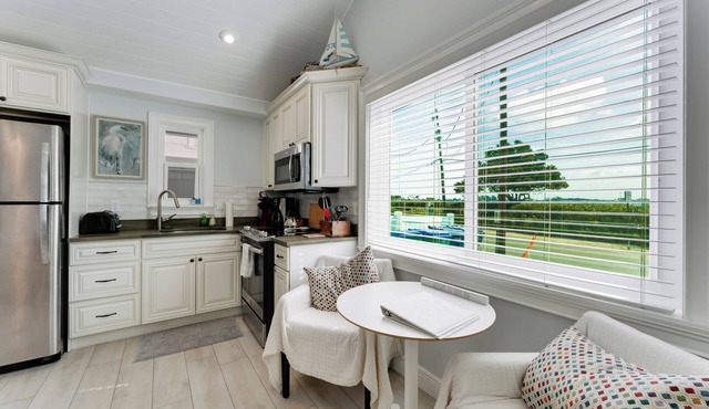 NEW LISTING.nHigh Tide—- Beach and Bay just steps away!n