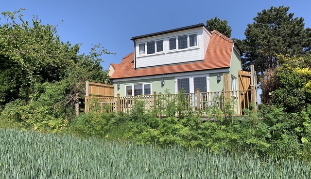 New lodge with stunning views. Close to country, city and coast.