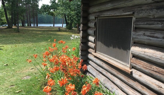 New! Sleeps 15 Level lawn to lake. Sandy beach. Two docks. Great fishing.