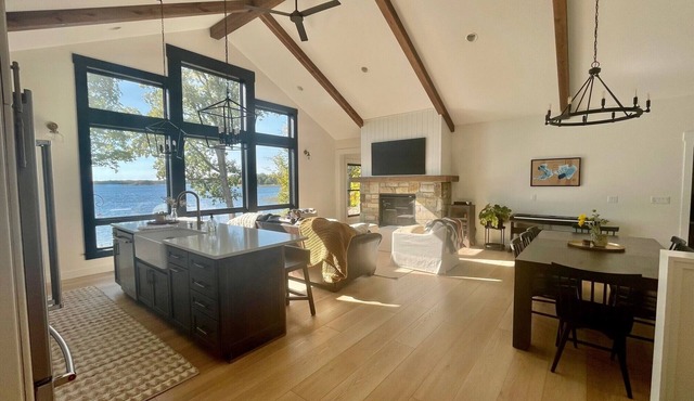 New, stunning modern lake home with private swimming beach and dock