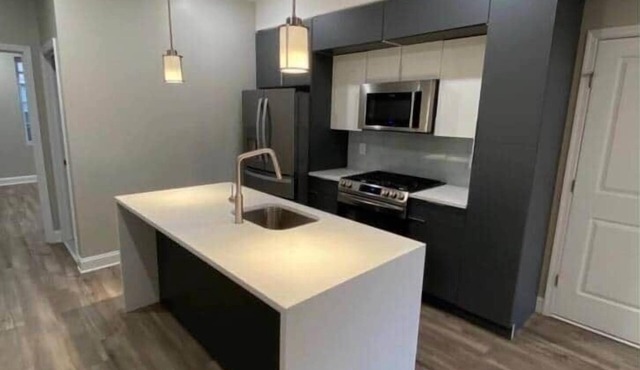 New three bedroom art museum area with backyard