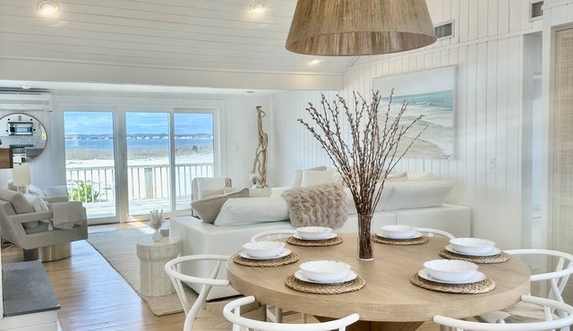 NEW TO MARKET! Stunning Dune Road bay front, steps to private ocean access!