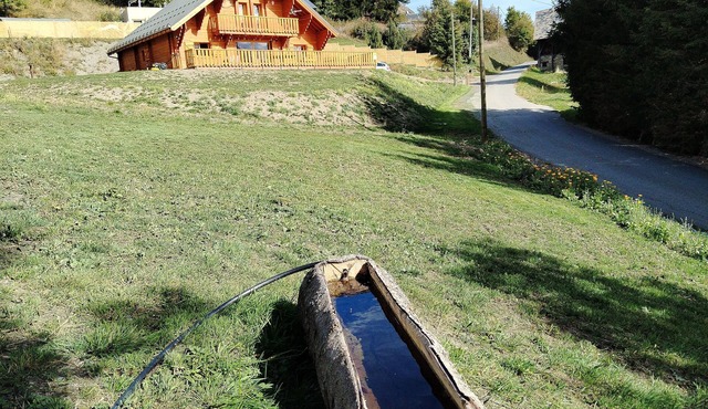 New traditional chalet in a mountain village in the Alps.