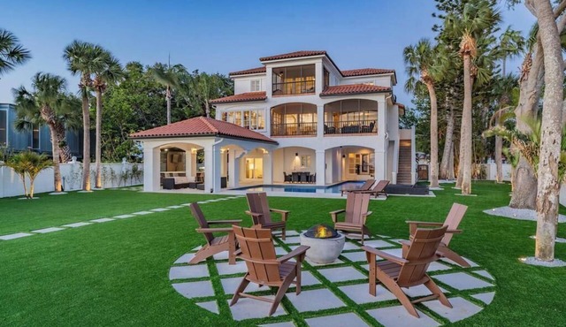 NEW Waterfront 6 bedroom home with large pool and luxurious outdoor living area!