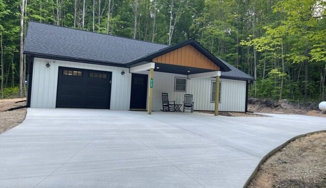 Newly built barndominium in the forest.