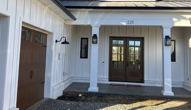 Newly built large custom built lakefront house with private dock and a wet cove.