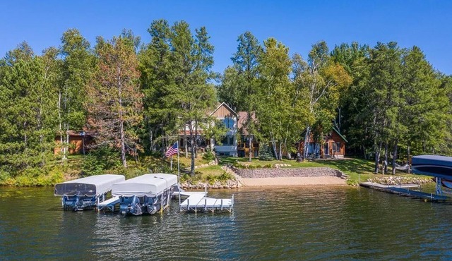 NEWLY BUILT, MODERN HOME on the WHITE FISH CHAIN! Sandy beach with Sunset View