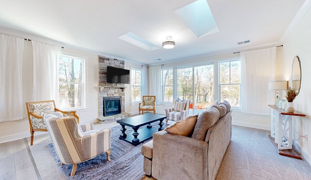 Newly built riverfront home with dock, kayaks, basketball court, & game room