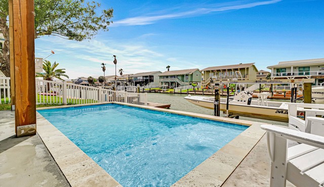 Newly constructed, canal-front home with private dock, covered deck, pool & W/D