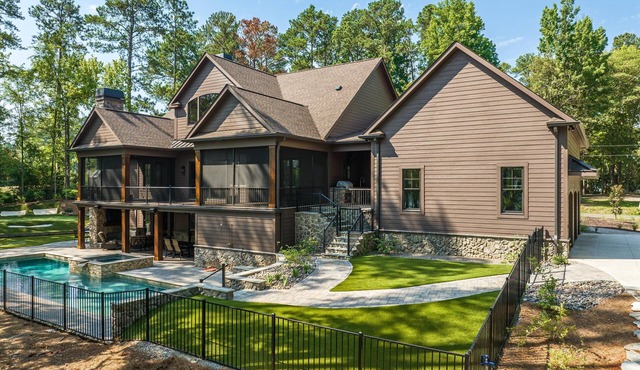 Newly constructed luxury retreat on Lake Thurmond. The sleeping arrangements for this property are 3 queen beds.