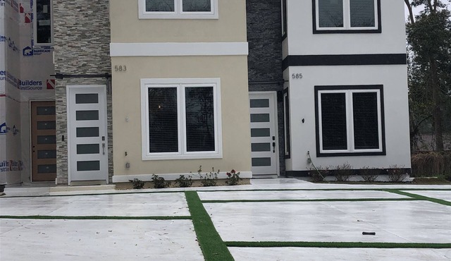 Newly constructed modern home with luxurious rooftop patio