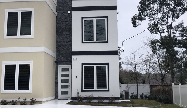 Newly constructed modern home with luxurious rooftop patio