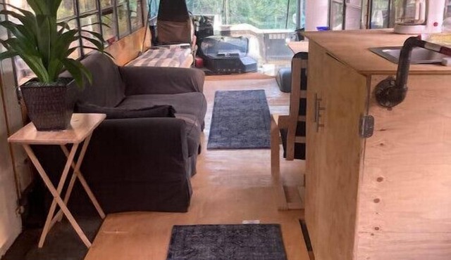 Newly converted 3-season bus. Outdoor shower.n