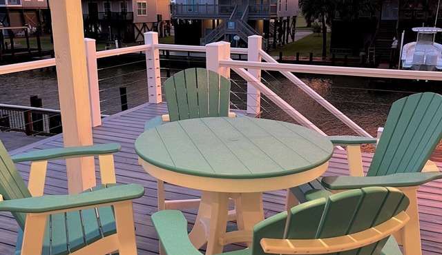 Newly Listed! "Wastin' Time", a beautiful canal front cottage on Dauphin Island