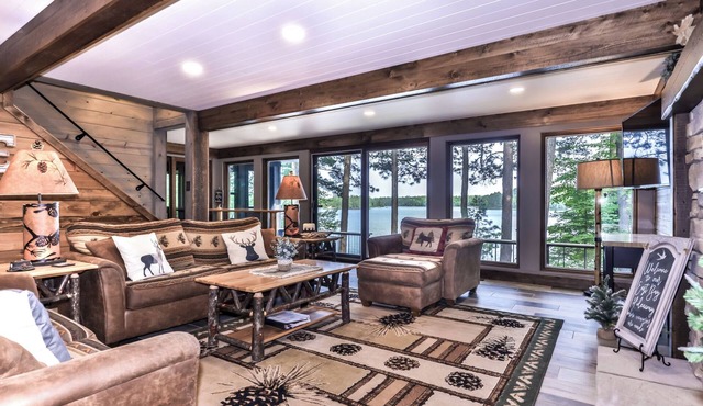 Newly remodeled private lakefront home with dock, enclosed porch, and fire pit!